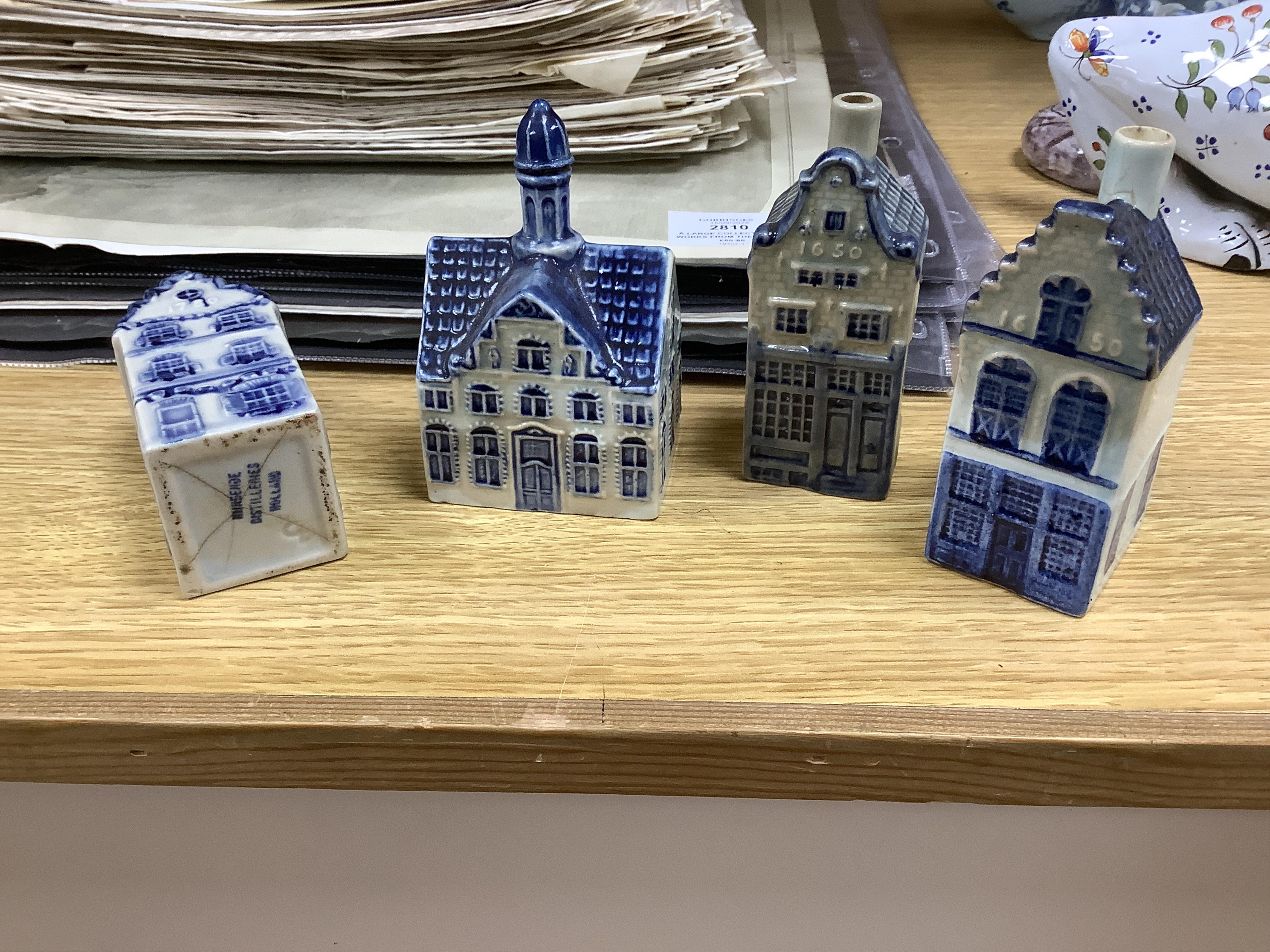 A collection of twenty seven KLM Delft blue miniature houses presented to Business class passengers together with a Delft jug - 20.5cm high